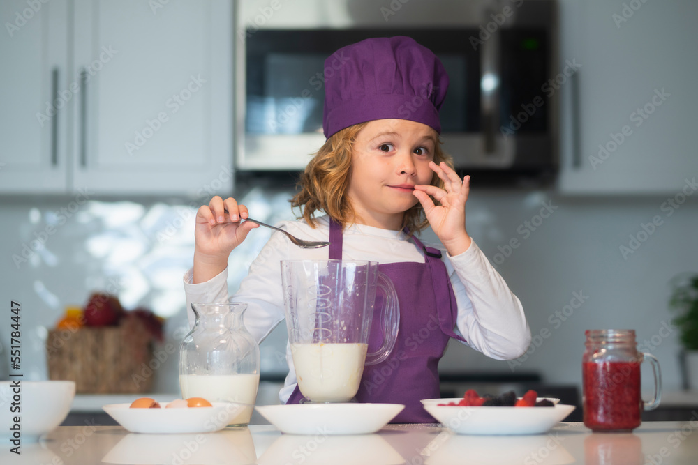 Chef child cooking healthy meal and dinner preparation. Kid making tasty delicious. little boy in chef hat and an apron cooking in the kitchen. Chef child cooking healthy meal and dinner preparation. Kid making tasty delicious. little boy in chef hat and an apron cooking in the kitchen.