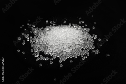 Desiccant Silica Gel Adsorbent Crystals on Black Background, Desiccant Polymer Balls photo