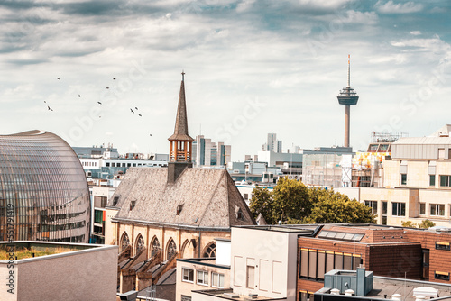 Distant aerial view of the Cologne city with the Antoniterkirche church and Tv tower as an architectural dominant. Real estate and urban life in Germany. photo