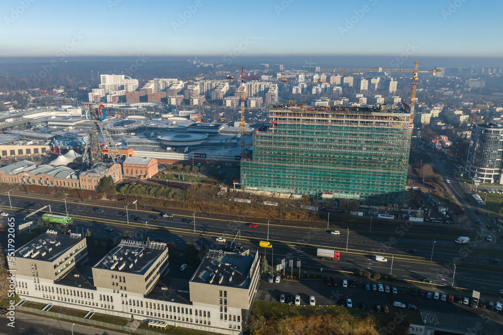 Construction site with a tower crane. Construction of residential buildings. Panoramic view of the construction of skyscrapers. Landscape with a modern city, Katowice.