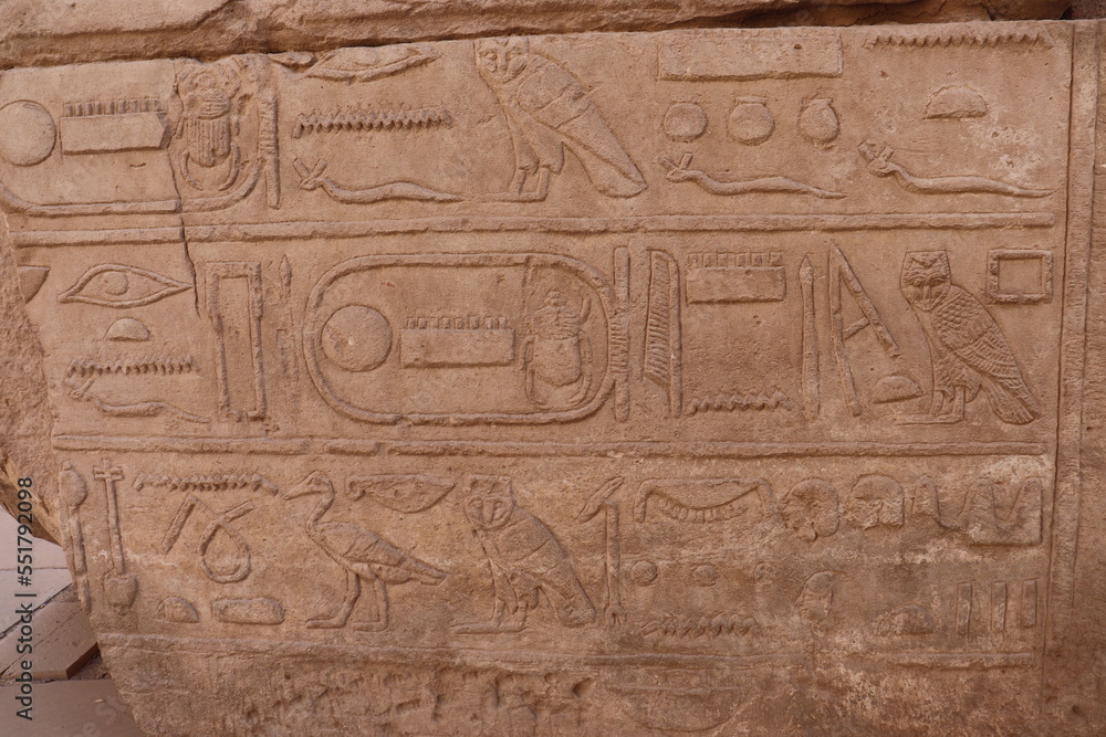 Ancient egyptian hieroglyphs carved at Karnak temple in Luxor 