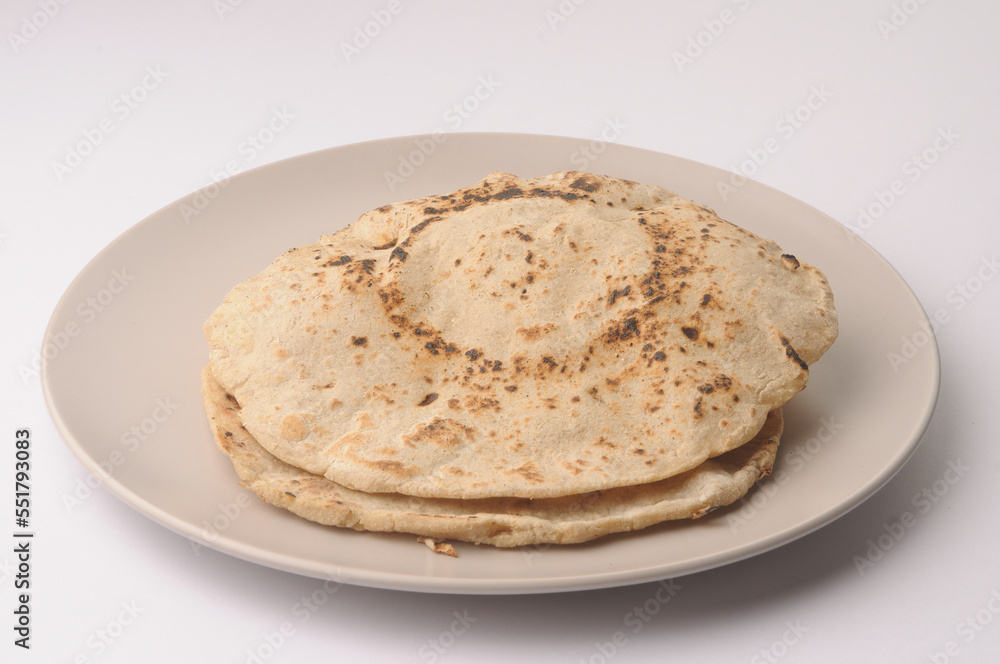 Jowar rotis or jowar bhakri, made from jowar a grain harvested in India, Maharashtra Jowar rotis or jowar bhakri, made from jowar a grain harvested in India, Maharashtra