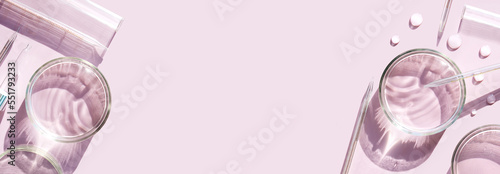 banner serum in petri dishes on light pink background cosmetic research concept photo