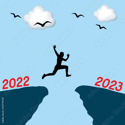 Happy new year Silhouette background. A man jumping over cliff and jump between 2022 and 2023 years. Photo Silhouette and new year concept idea.