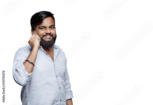 PNG of a happy young Indian man with beard talking on the phone with expressive eyes photo