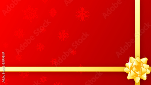 赤い雪の結晶模様の包装紙と黄色のリボン