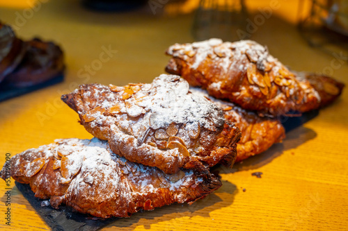 French sweet dessert pastry with almonds on display in french bakery