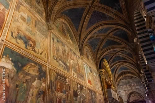 San Gimignano, Italy, 15 April  2022: Beautiful frescoes in the medieval cathedral photo