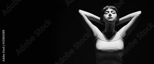 Art female dark portrait with hands and face. Unusual photo of body woman