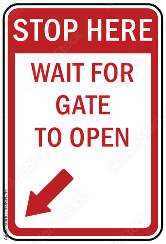 Stop at gate sign and labels stop here wait for gate to open