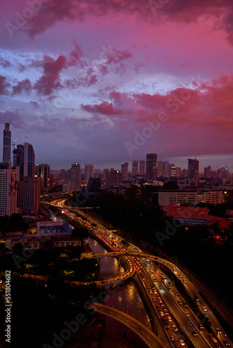 An incredible pink and purple sunset over a modern big city