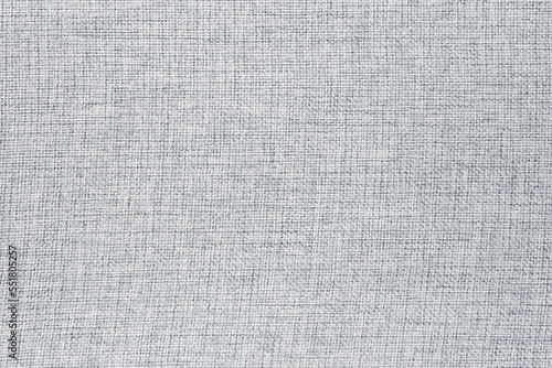 The texture of the light gray furniture fabric. Material for the surface of the sofa