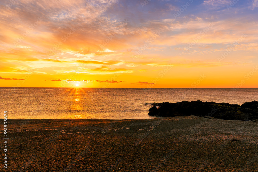 Fototapeta premium morning or evening landscape with nice beach during sunrise or sunset in sea with amazing isle with rocks and beautiful clouds on background