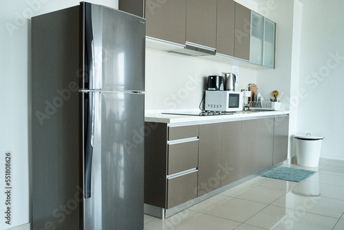 Bright interior of the kitchen nook with built-in induction stove