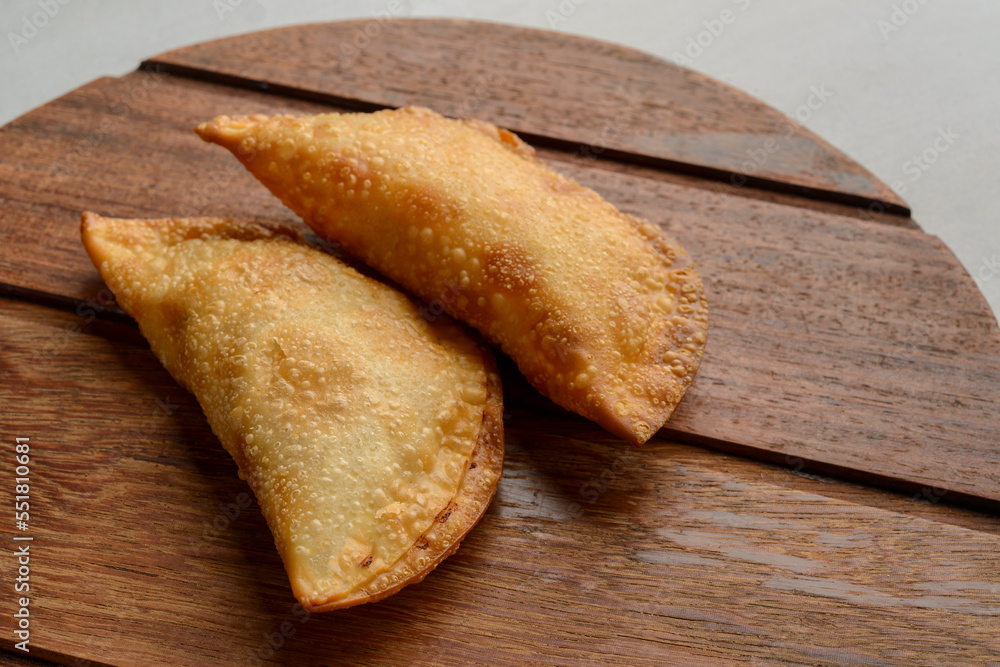 Pastries on wooden background. Traditional Brazilian snack known as 