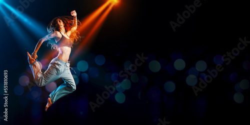 Athletic woman dancing on stage © stokkete