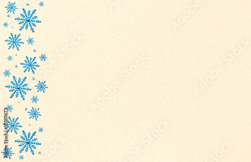 Winter beige pink saturated bright background with random blue snowflakes left side. Christmas, New Year card with copy space.