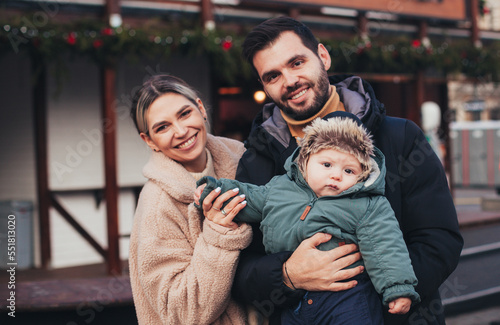 family on the street in christmas town