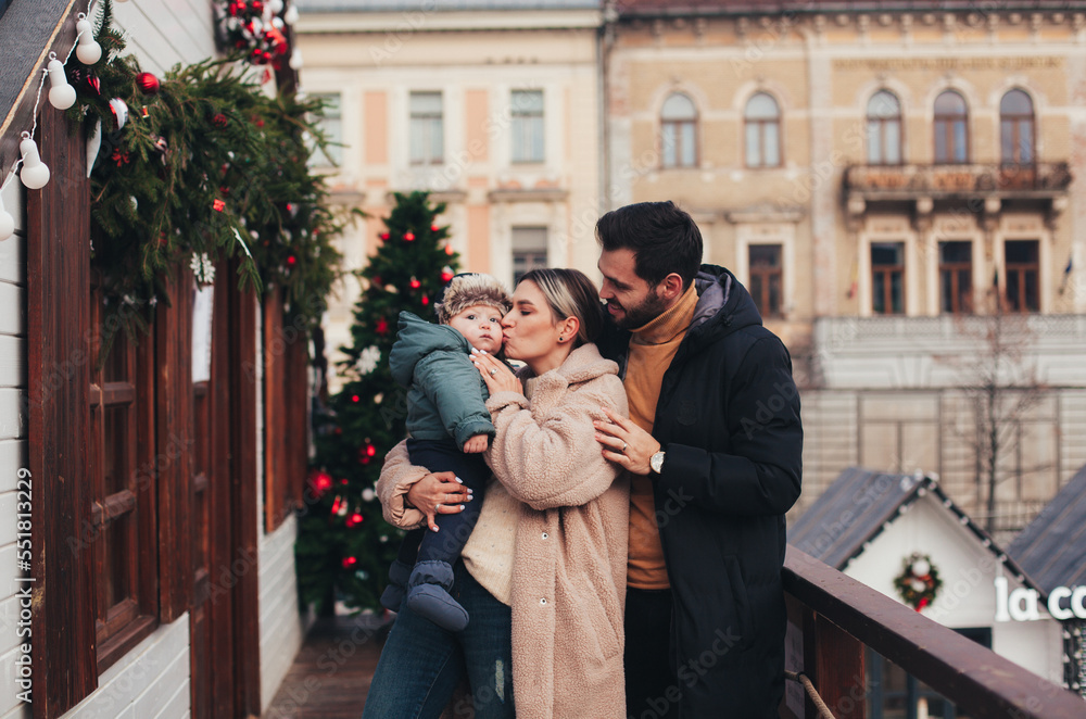 family on the street in christmas town