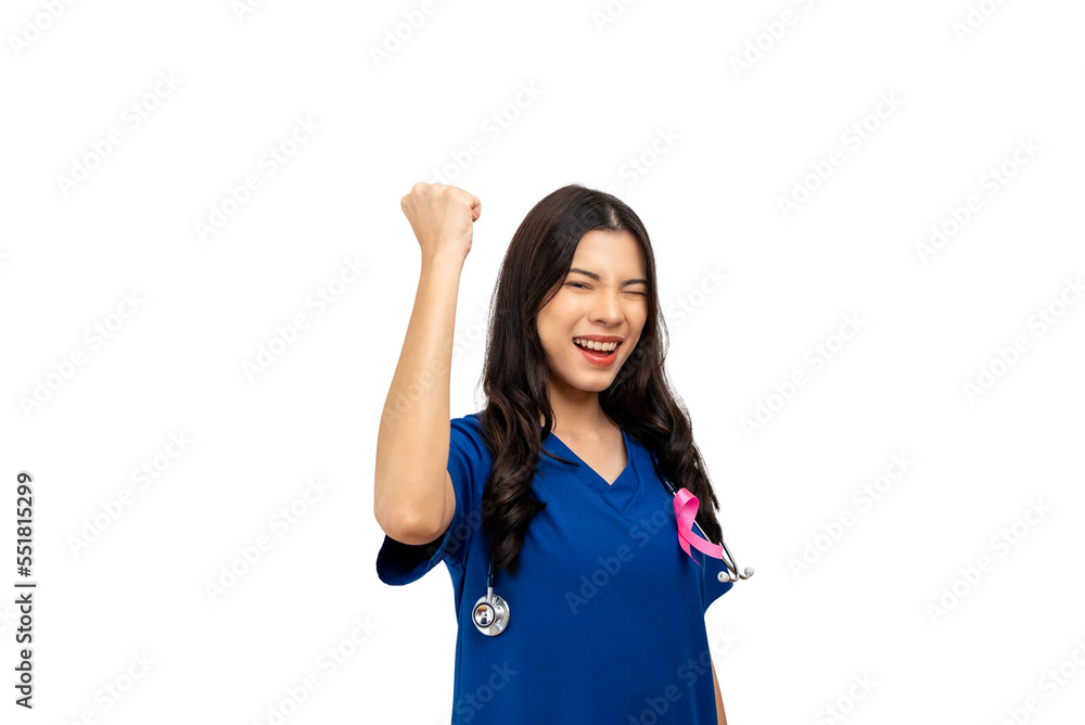 Doctor nurse woman in blue uniform stuck pink ribbon symbolizing World Cancer Day on the chest, raise her hands to fight Breast Cancer. Isolated white background. Doctor nurse woman in blue uniform stuck pink ribbon symbolizing World Cancer Day on the chest, raise her hands to fight Breast Cancer. Isolated white background.