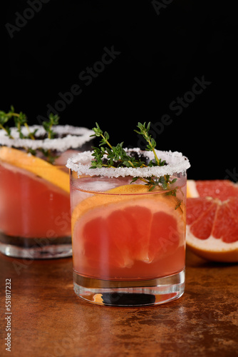 Pink pamola with red grapefruit and tequila. The red grapefruit adds the perfect amount of sweetness, and the vibrant color of the juice makes this a great cocktail. Organic vegetarian drink. photo