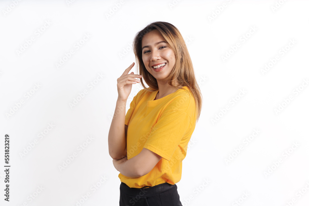 Hot asian pretty young woman smiling isolated on white, yellow t-shirt, looking camera Hot asian pretty young woman smiling isolated on white, yellow t-shirt, looking camera