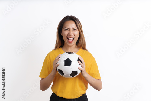 Happy Asian pretty woman soccer fans sport fans yellow t-shirt isolated on white background. © makibestphoto