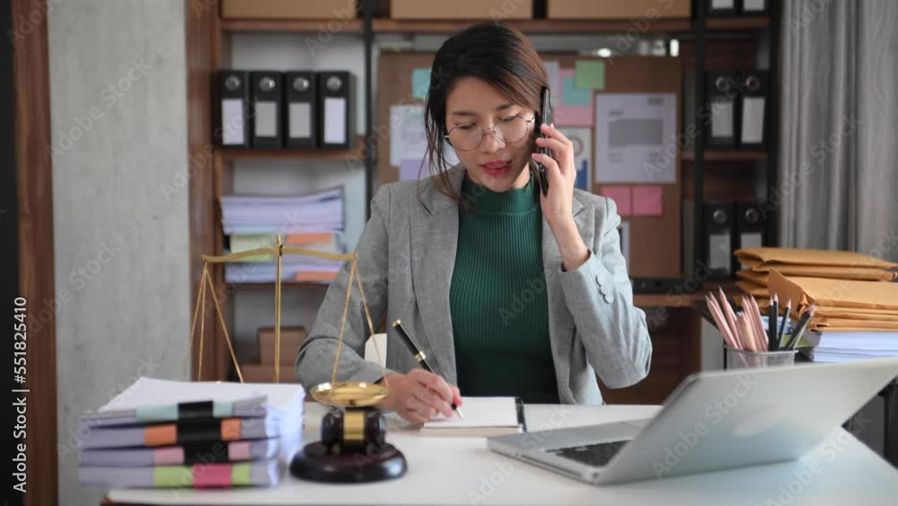 Asian woman lawyer working and gavel, tablet, laptop in front, Advice justice and law concept.. Asian woman lawyer working and gavel, tablet, laptop in front, Advice justice and law concept..