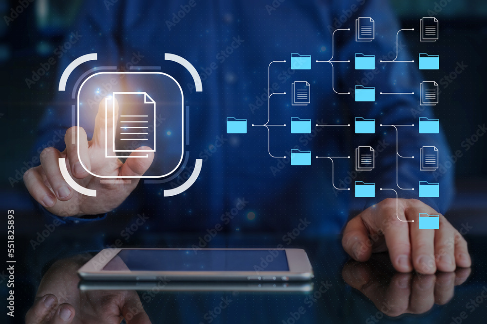 Document management system (DMS) and business process automation technology being setup by IT consultant working on digital tablet computer. Online file storage.