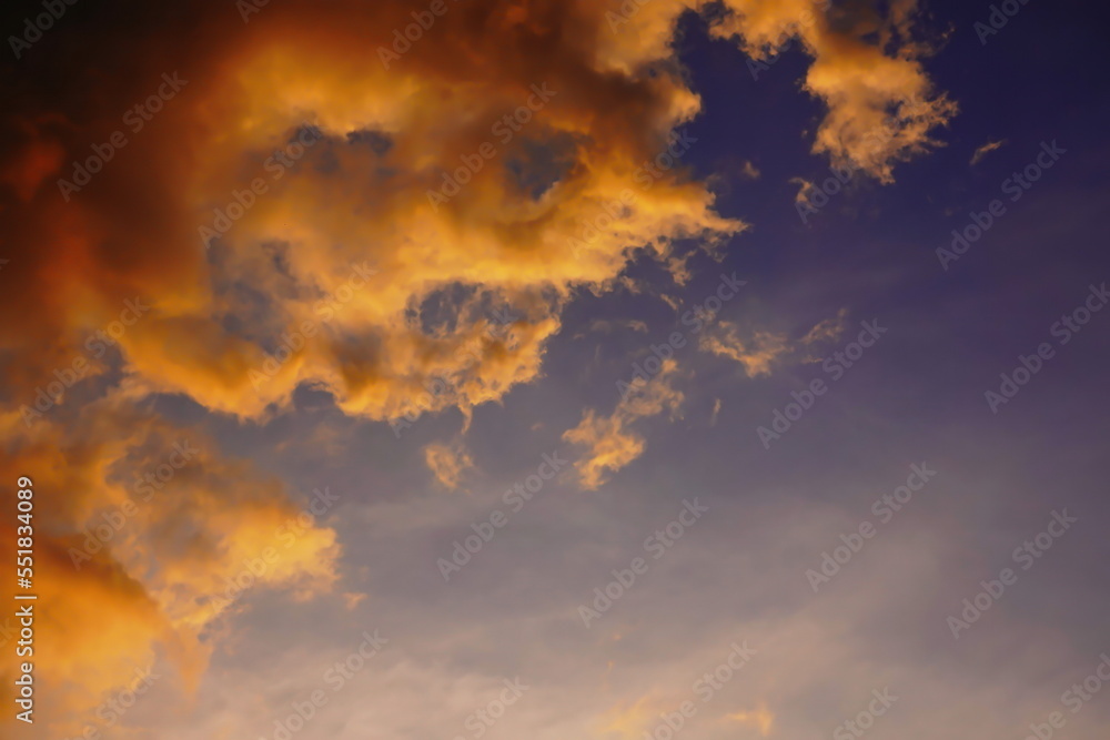 Blur focus Sunset sky yellow clouds on a blue sky background Blur focus Sunset sky yellow clouds on a blue sky background