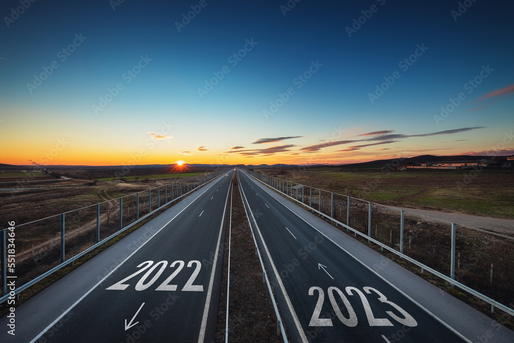Fototapeta premium Driving on open highway road at beautiful sunny day to new year 2023, aerial view, transportation, logistic, travel and lifestyle concept