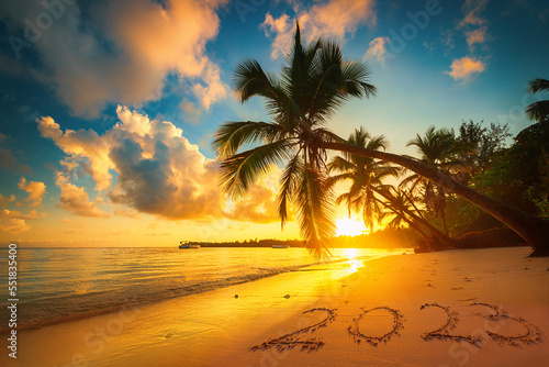 Happy New Year 2023 text on island beach sand. Sea sunrise. Punta Cana  Dominican Republic