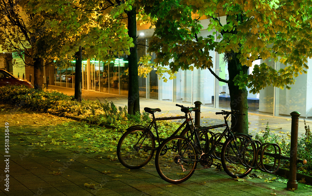 Bicycles in the parking lot at night time