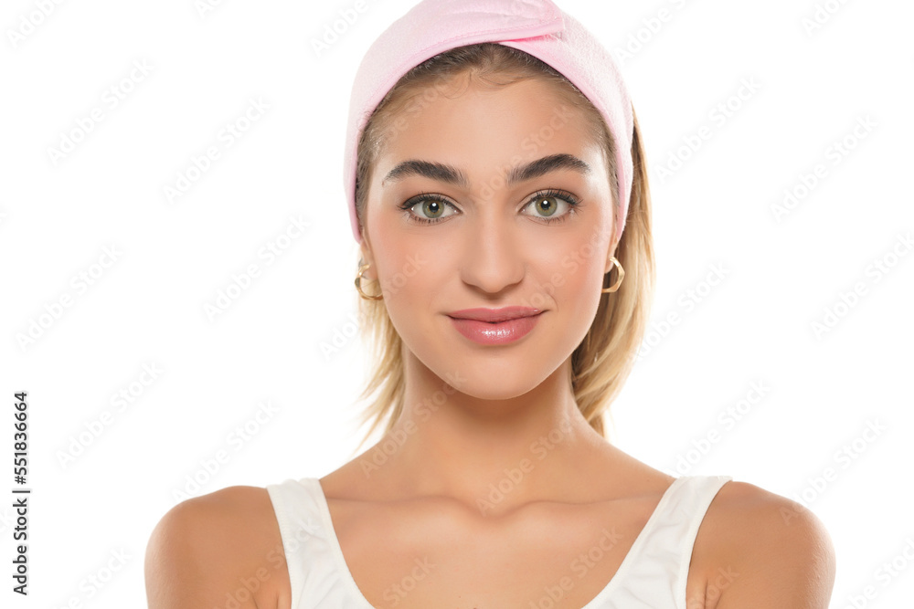 Close up portrait of beautiful young smiling woman face on a white background Close up portrait of beautiful young smiling woman face on a white background