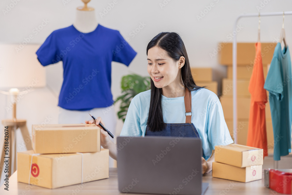 Asian women SME selling clothes online, She is answering customers' questions by phone and laptop at home, Starting Small business entrepreneur freelance, Online business, SME concept.
Asian women SME selling clothes online, She is answering customers' questions by phone and laptop at home, Starting Small business entrepreneur freelance, Online business, SME concept.