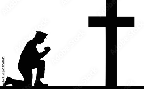 Cop Praying at Memorial Cross