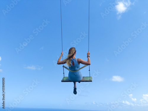Women swinging in the sky 