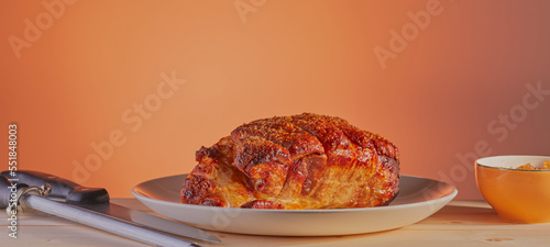 Картината върху платно Roasted leg of pork with crackling isolated on a gradient background