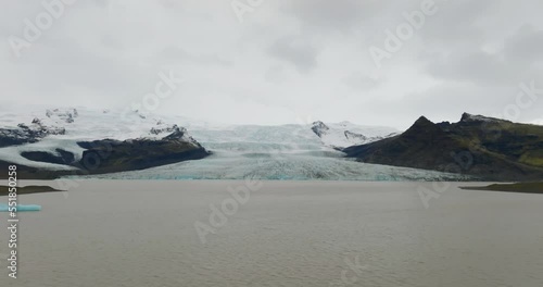 aerial view of Fjallsjökull glacier over lagoon in iceland  photo