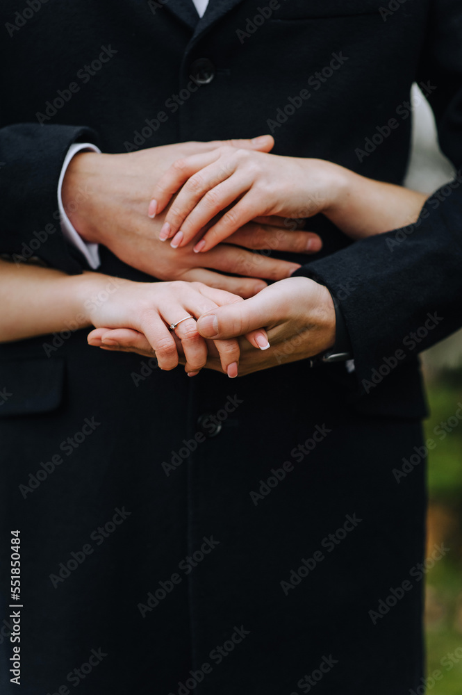 Obraz premium Hands, fingers of the bride and groom, man and woman together close-up.