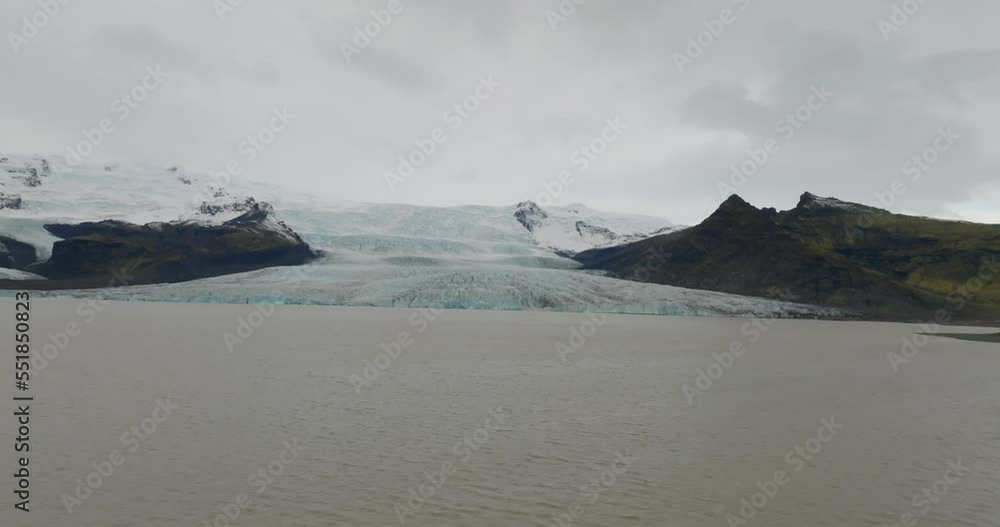 aerial view of Fjallsjökull glacier over lagoon in iceland aerial view of Fjallsjökull glacier over lagoon in iceland