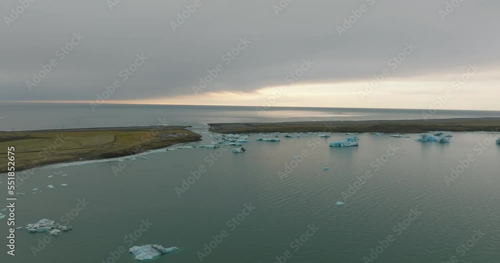 aerial view of Jökulsárlón Glacier Lagoon and diamond beach with mountains on background aerial view of Jökulsárlón Glacier Lagoon and diamond beach with mountains on background