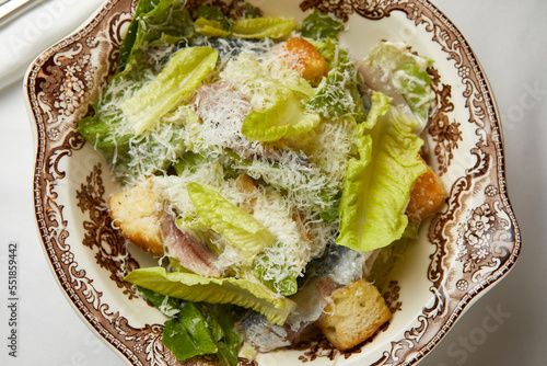 fresh caesar salad with anchovies on a beautiful plate