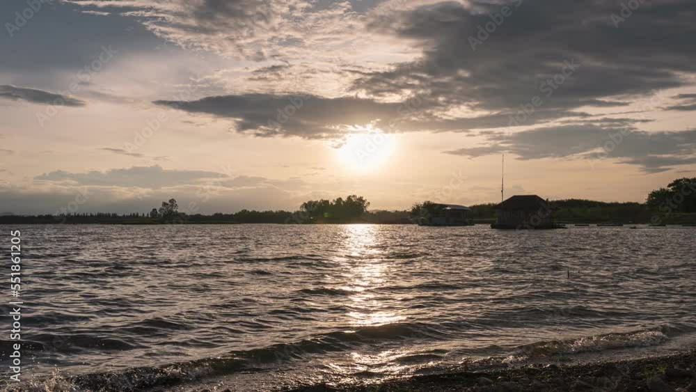 Sunset over Huai Mai Teng natural reservoir in countryside at Ratchaburi Sunset over Huai Mai Teng natural reservoir in countryside at Ratchaburi