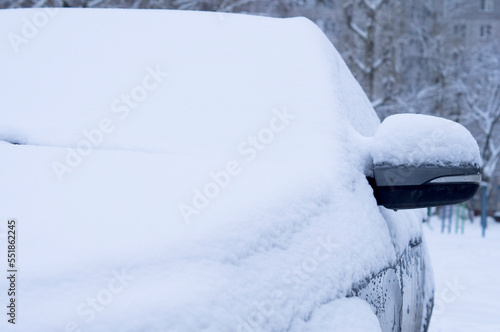 Winter. Modern car covered with snow