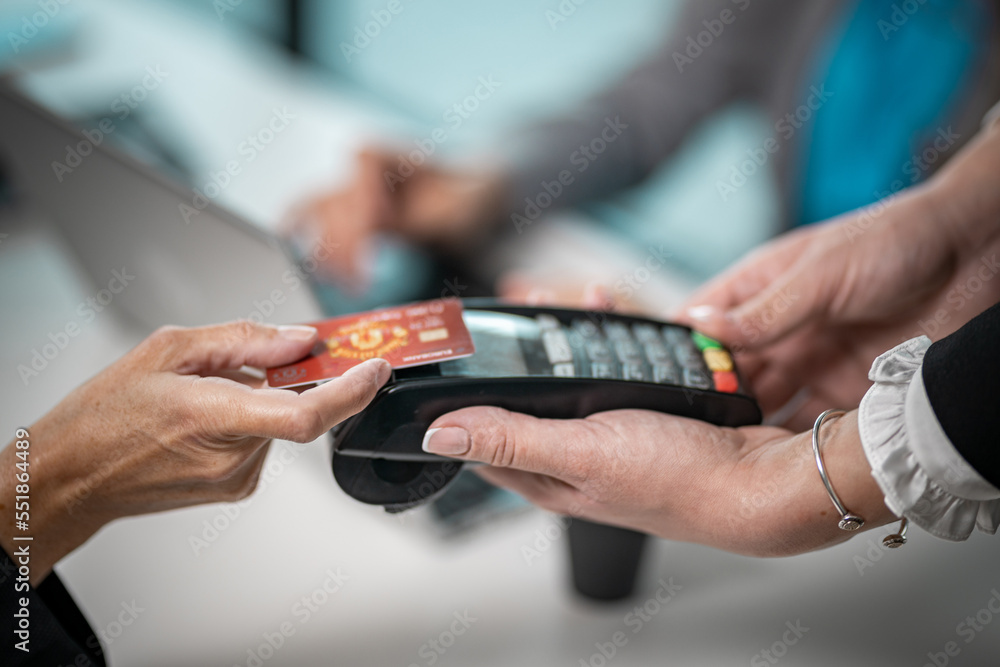 Close up on contactless paying terminal for credit cards, contactless paying
Woman hand Close up on contactless paying terminal for credit cards, contactless paying
Woman hand