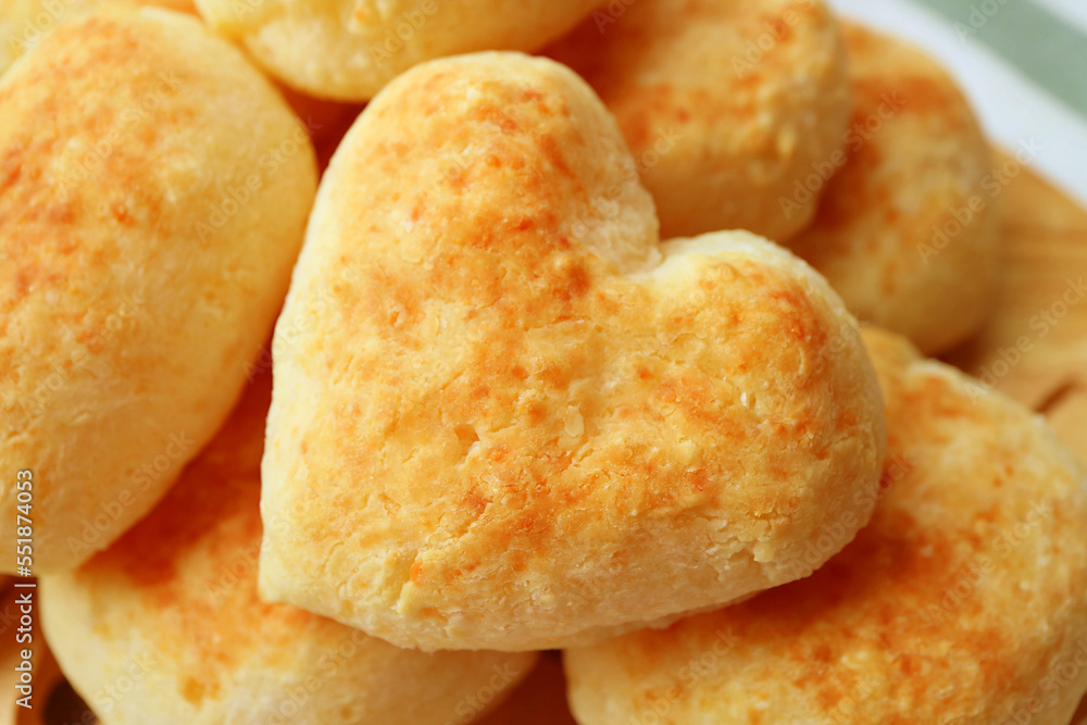 Closeup of Delectable Heart Shaped Freshly Baked Pao de Queijo or Brazilian Cheese Bread Closeup of Delectable Heart Shaped Freshly Baked Pao de Queijo or Brazilian Cheese Bread