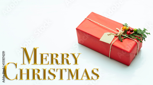 Christmas decoration. Text in golden letters wishing Merry Christmas.