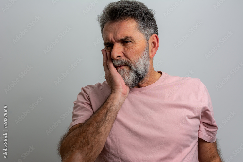 Obraz premium Close up photo amazing he him his middle age macho hand arm hold cheekbone teeth terrible pain injury sadness cry facial expression weakness wear casual white t-shirt isolated grey background