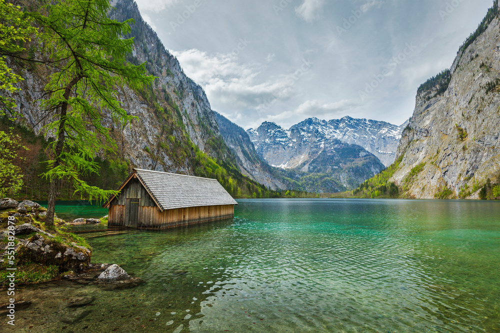 Fototapeta premium Boat dock hangar on Obersee mountain lake in Alps. Bavaria, Germany